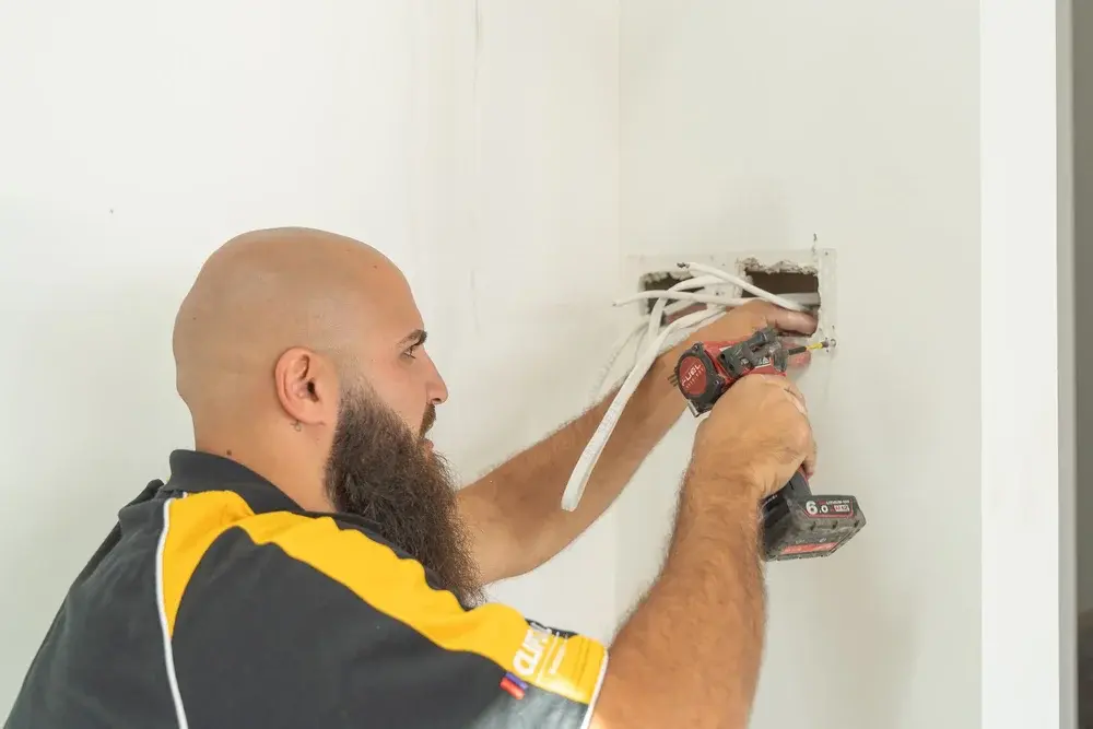 Flash-Electrical-SA-Worker-Drilling.webp